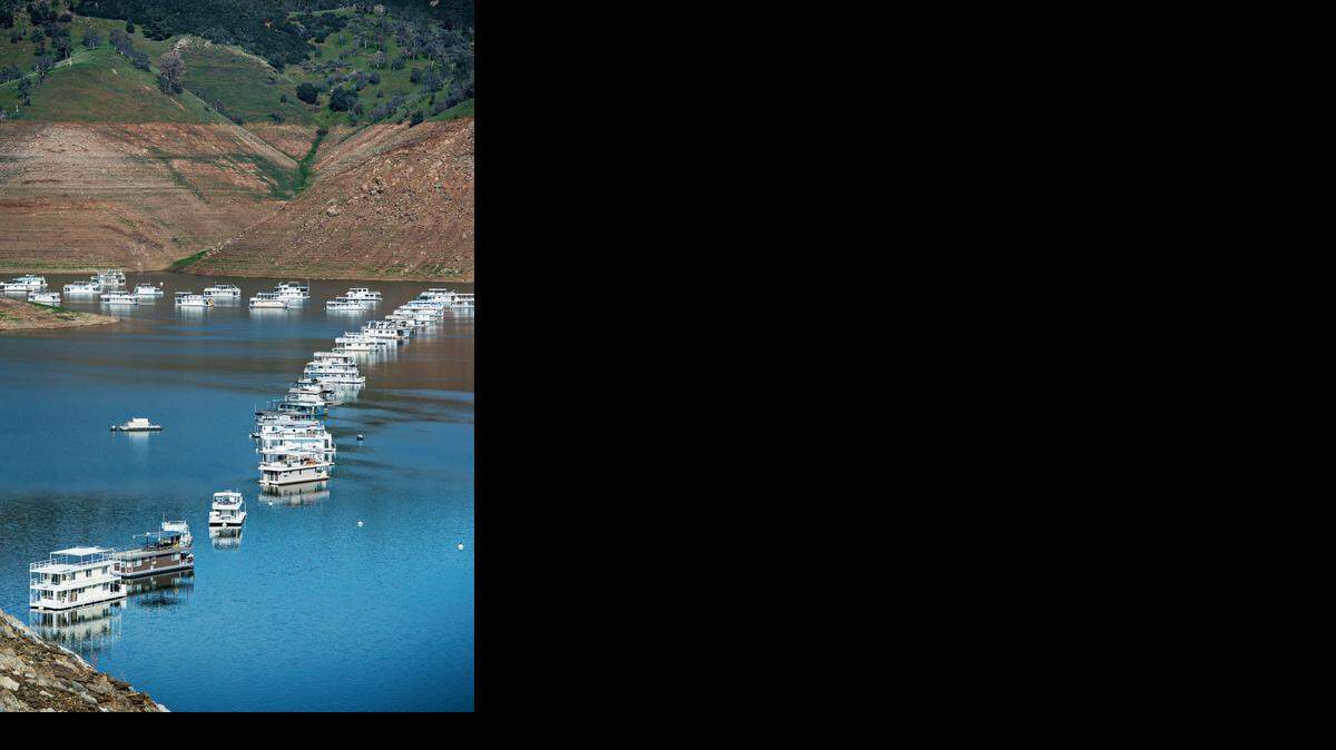 Houseboats are docked in Lake McClure<137>, which is in Snelling, Calif., are seen on Wednesday,<137> on Feb. 11<137>, 2015<137>. <137>According to Merced Irrigation District public and government relations officer Mike Jensen, Lake McClure is currently at about 6 to 7 percent of its 1 million acre-foot capacity. The lowest capacity since completed construction of the New Exchequer Dam was completed in 1967 was recorded on Feb. 3, 2015<137> The reservoir measured at a record low 63,489 acre-feet of water on Feb. 3.