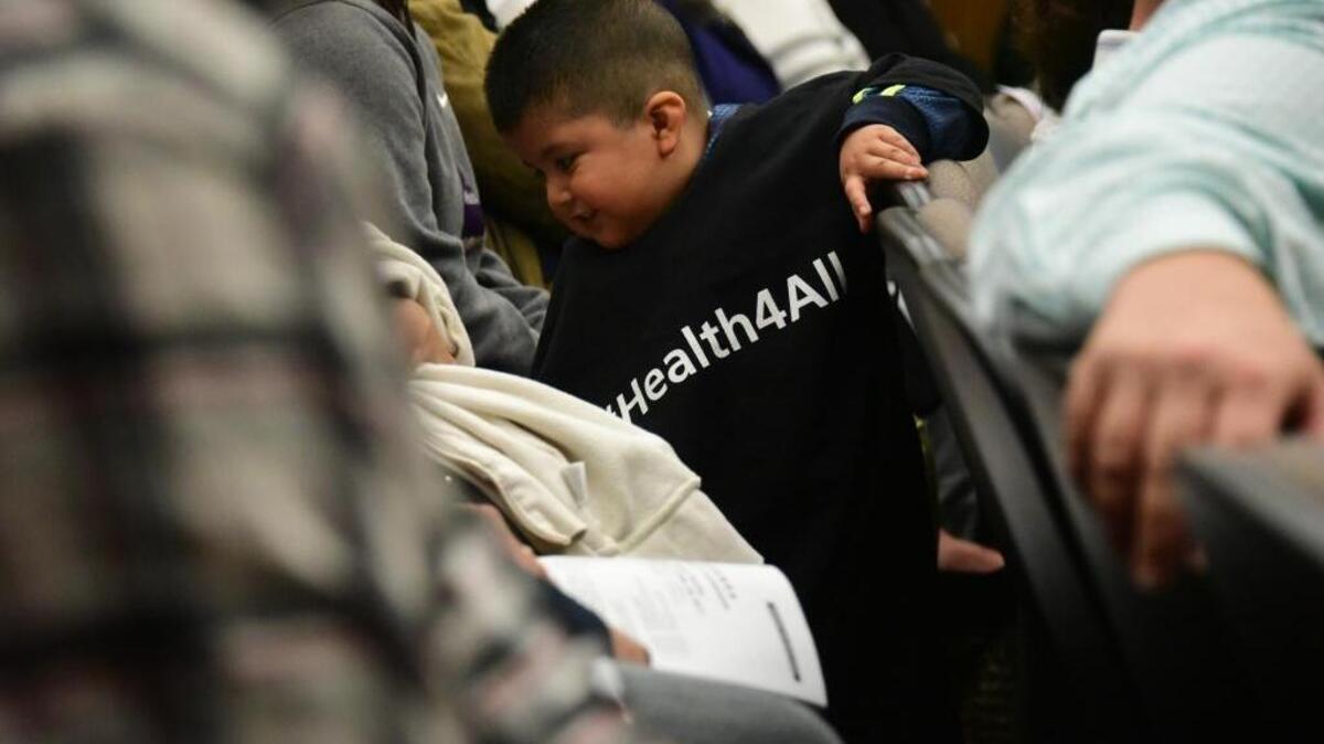 A young child at the Merced County Board of Supervisors meeting on Tuesday, April 25, 2017. Dozens of people wearing T-shirts with the phrase #Health4All came to the meeting to give testimony in hopes the board will vote to hold a study session to discuss developing a program for health coverage for those who currently have no options – undocumented people.