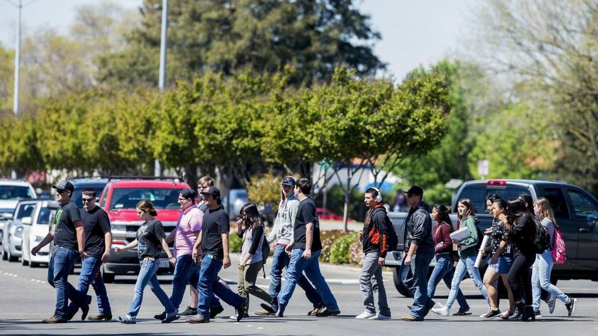 Merced High School students cross West Olive Avenue in Merced, Calif., on Wednesday, March 29, 2017. According to Merced County law enforcement agencies, pedestrian deaths between the months of January and June have either stayed the same or increased from 2015 to 2016.