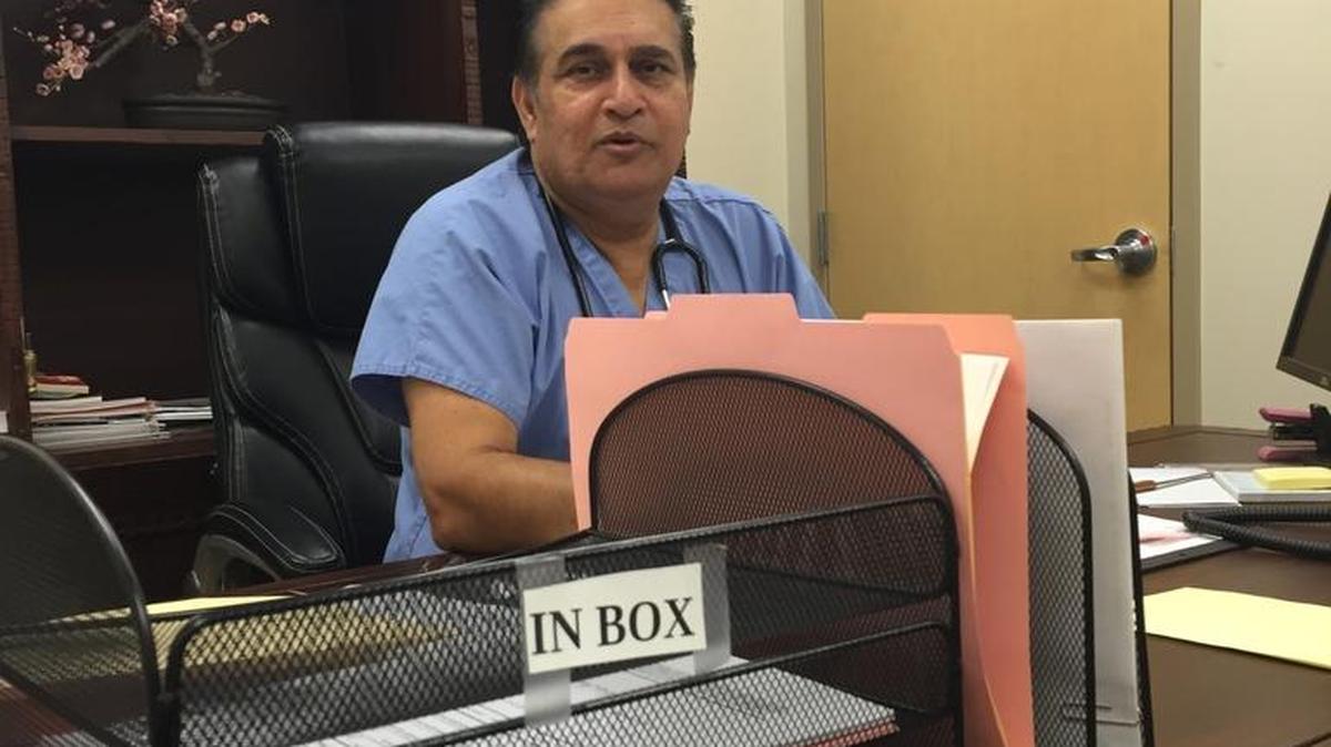 Dr. Imtiaz Malik, medical oncologist and hematologist for El Portal Cancer Institute, sits in his office on Tuesday, Aug. 23, 2016, and explains the financial burdens cancer patients have to endure.