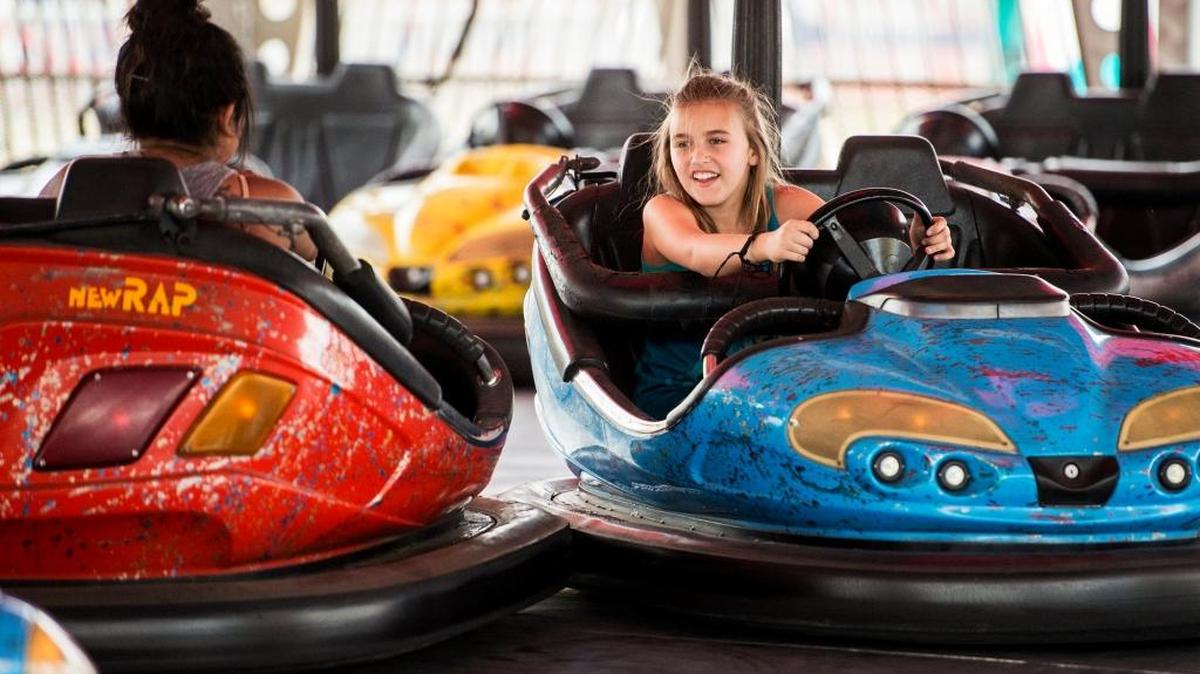 Grace Bergeron, 9, of Phoenix drives a bumper car at the Merced County Fair in Merced, Calif., Saturday, June 11, 2016. Fair organizers say the five-day event drew an estimated 74,541 people, an increase of 14 percent from last year.