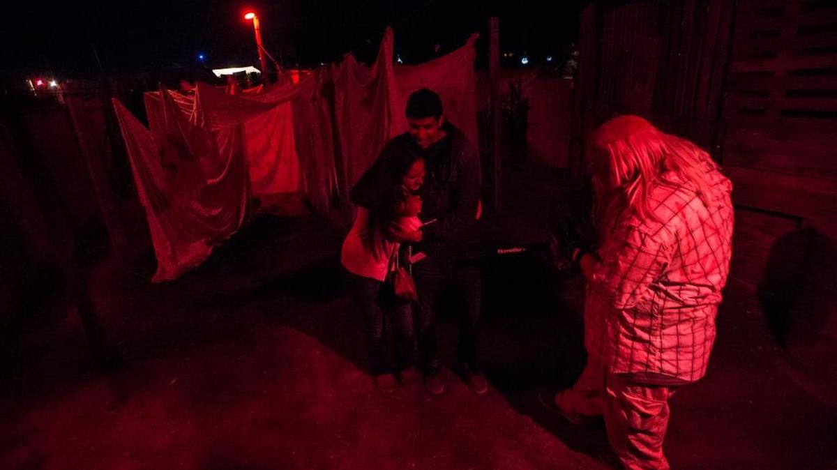 Armando Rocha, 23, of Merced scares guests with a chainsaw at Frightmare Farms on Thursday, Oct. 22, 2015.