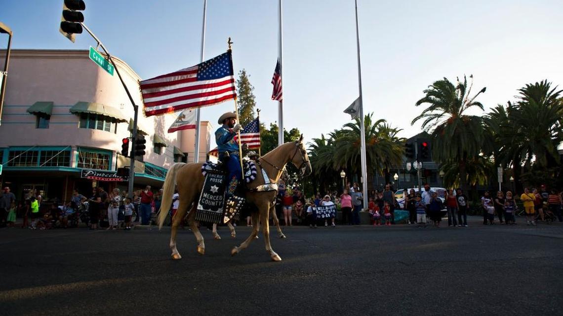 The Merced County Sheriff’s Posse make its way along Main Street during the American Patriot Chrome Cowboys parade to remember 9/11 in downtown Merced on Sept. 11, 2014.