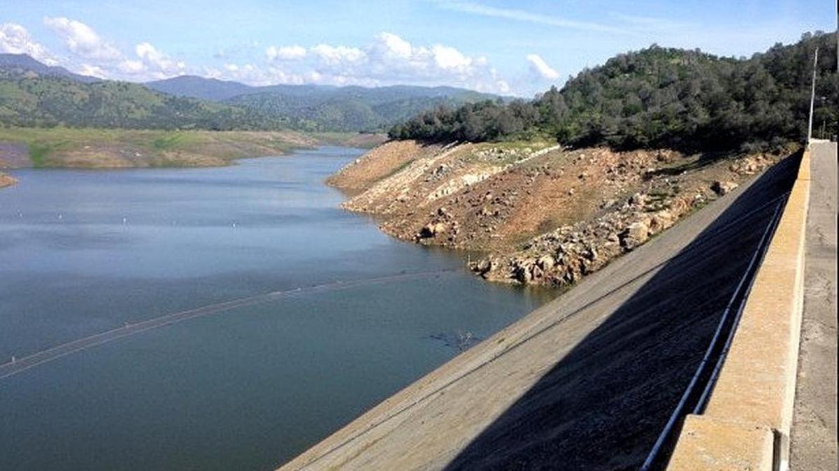 A photo from March 20 shows the 1920s Old Exchequer Dam submerged at Lake McClure for the first time since 2013 while the reservoir remained historically low due to the California drought.