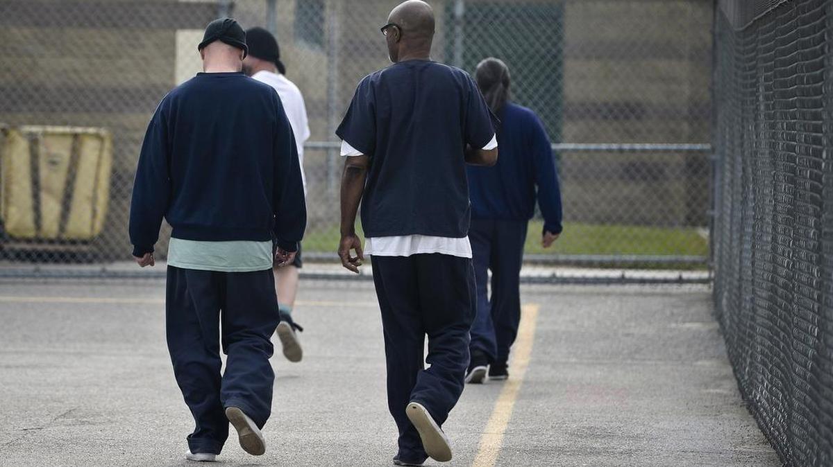
Inmates walk the facility yard at the John Latorraca Correctional Facility in El Nido.
