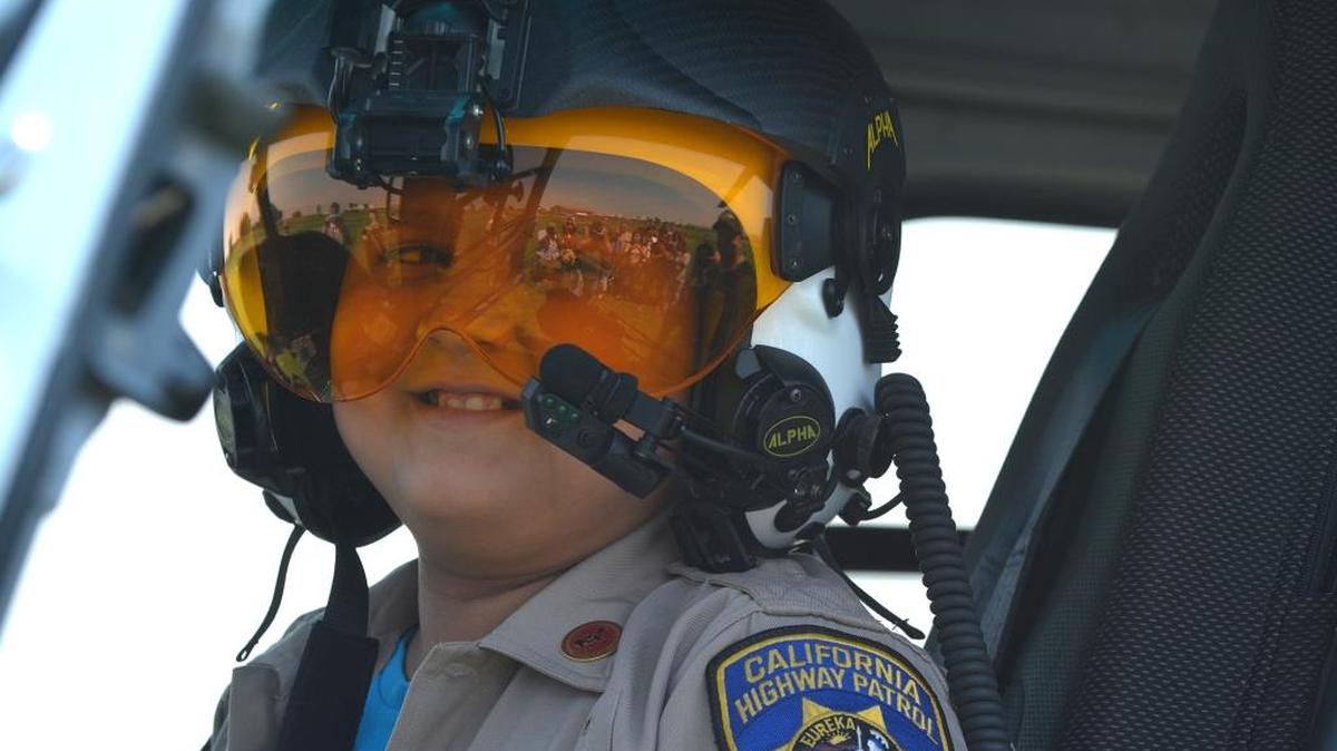 Bryan Ibarra, 11, looks at his family and friends as he gets ready to take off in a California Highway Patrol helicopter as part of a Make-A-Wish Foundation dream come true Monday, Aug. 22, 2016, at Gustine Middle School. Bryan was diagnosed in 2015 with T-cell acute lymphoblastic leukemia.