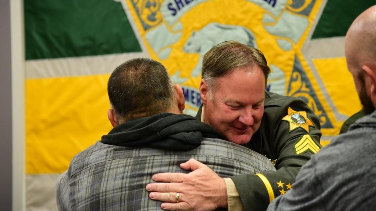 Mark Taylor, 49, who has been a patrol deputy for 23 years, gives hugs on Wednesday, May 31, 2017 after he took the oath and was promoted to sergeant in the Merced County Sheriff's Office.