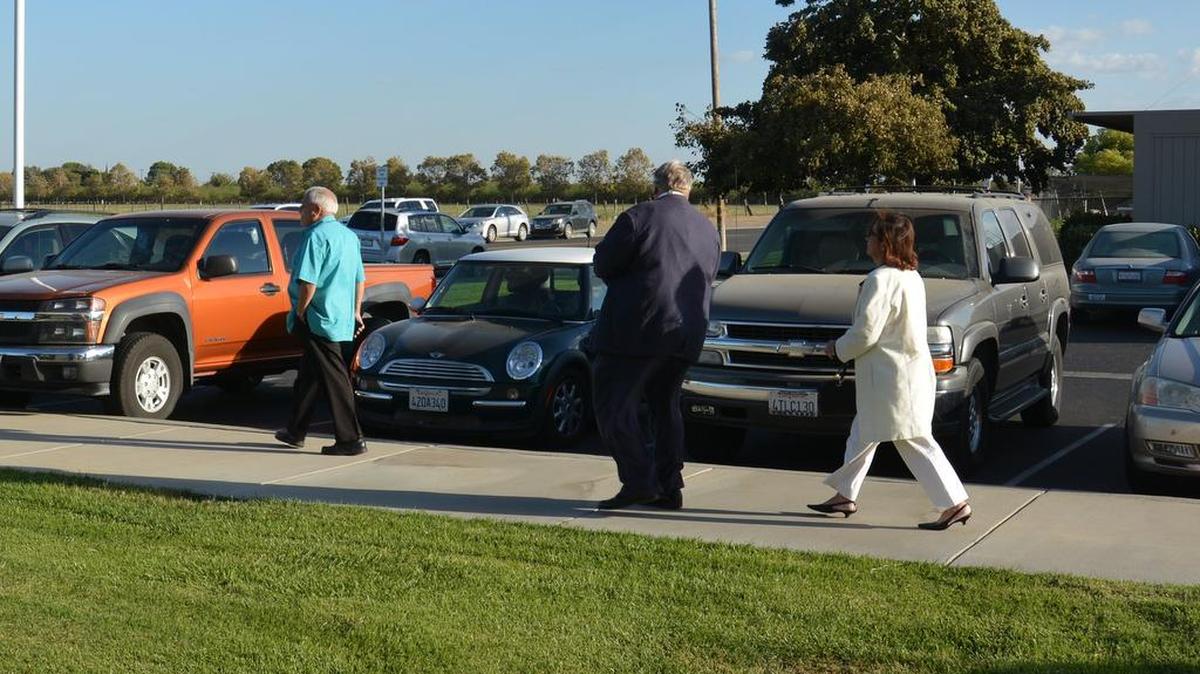 Los Banos resident Baldo Salcido, left, and two other members of the Community Advocacy Coalition leave a special board meeting Sept. 22, 2016, after it was determined a quorum wasn’t met.