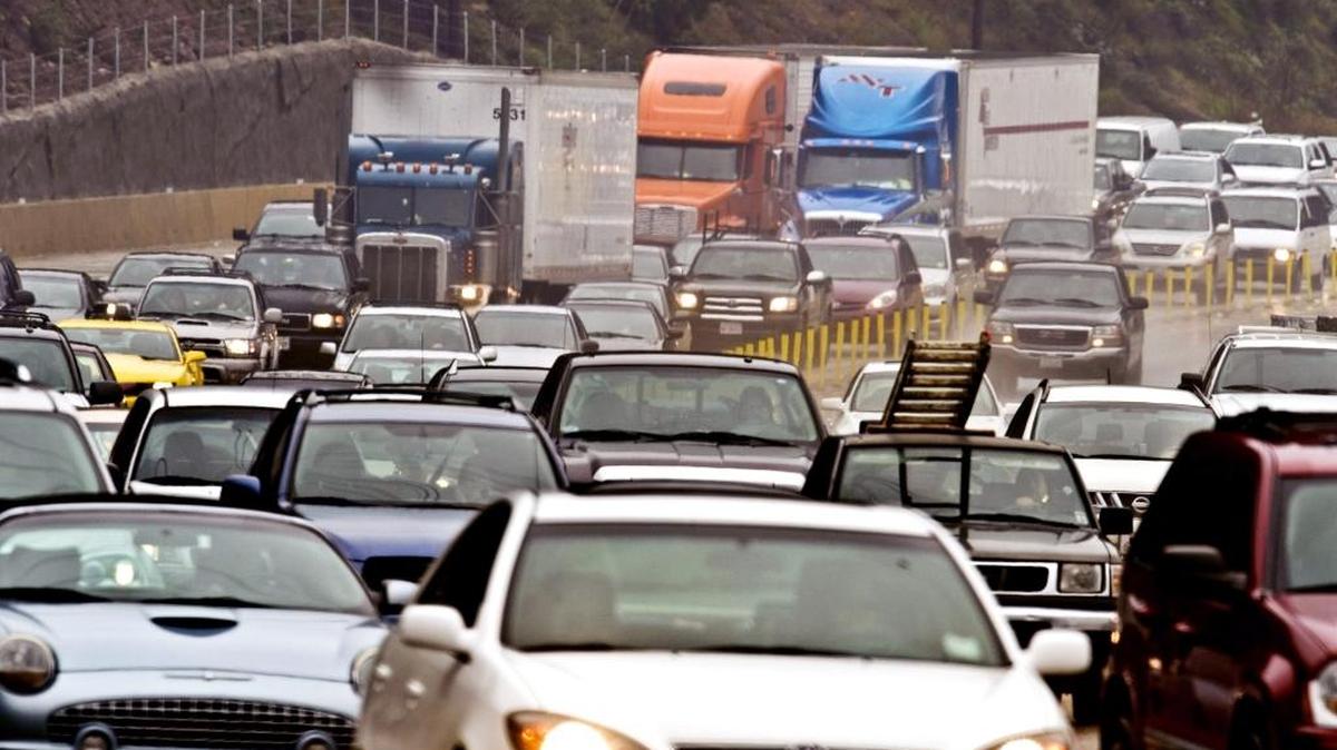 Traffic backs up on the eastbound State Route 91 freeway near Corona in 2010. California’s heavy traffic, nearly a billion vehicular miles each day, has increased the need for maintenance on highways, and local roads and streets.