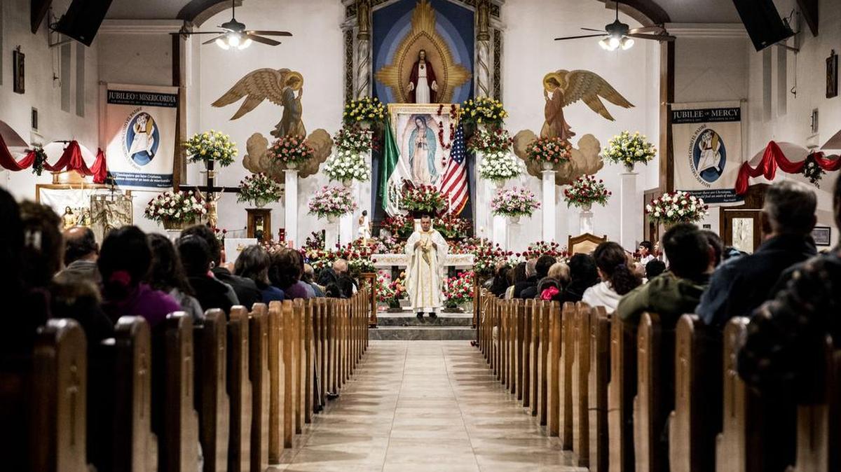 Churchgoers fill the pews at Sacred Heart Catholic Church in Merced where the Rev. Miguel Angel Rodriquez Viaz presides over the Virgin of Guadalupe mass.