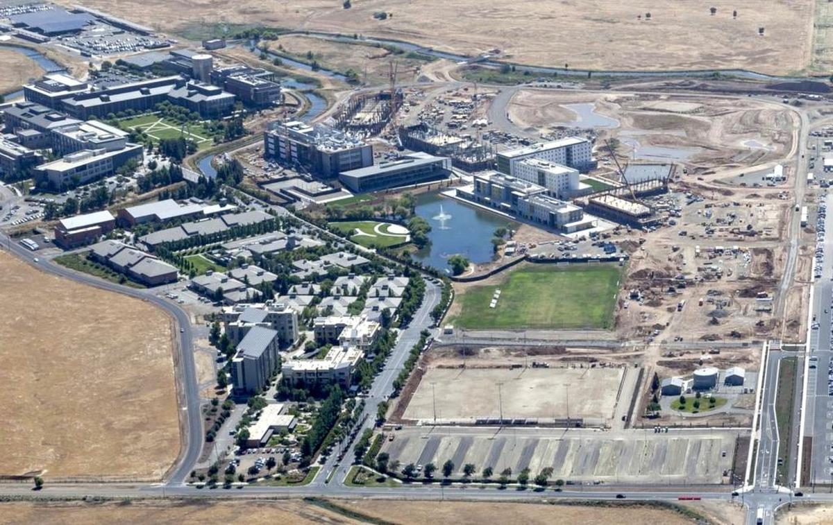 Aerial view of the UC Merced campus in an undated photo. Lake Road runs along the bottom of the photo and its intersection with Bellevue Road is in the bottom right.