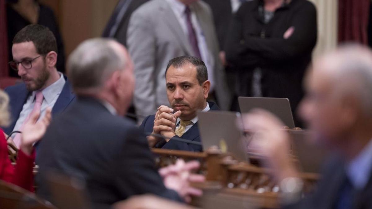 During the opening day of the Senate on Jan. 3, Sen. Tony Mendoza, D-Artesia, sits at his desk before announcing he will take a month-long leave of absence while an investigation into sexual misconduct allegations is completed.