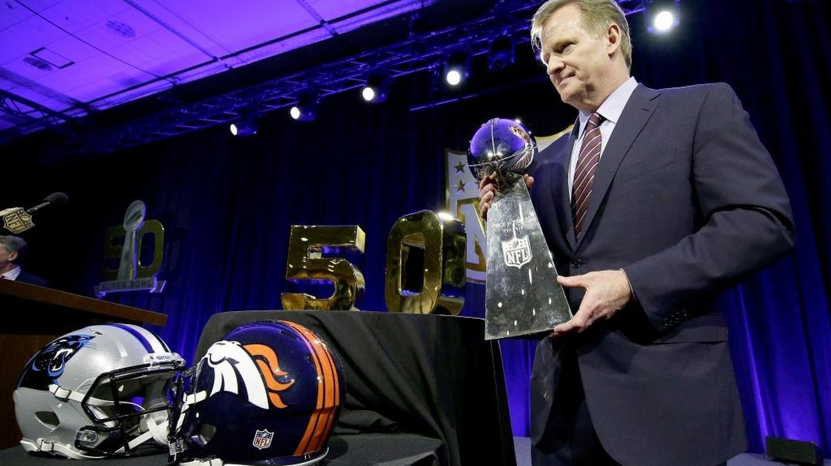 NFL Commissioner Roger Goodell poses with the Vince Lombardi Trophy after a news conference Friday, Feb. 5, 2016, in San Francisco.