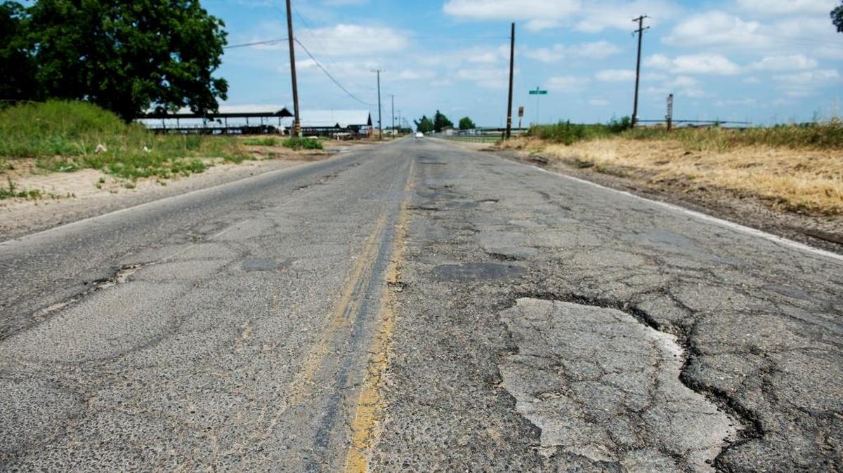 Potholes along Griffith Avenue in Delhi. Many motorists have filed claims for damages. To fix them, the county is going to need to pass Measure V.