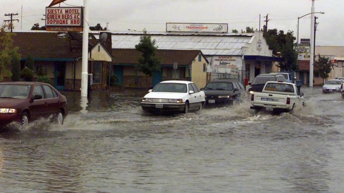 A storm in early 2000 left V Street flooded in Merced; today’s rains are expected to be worse.