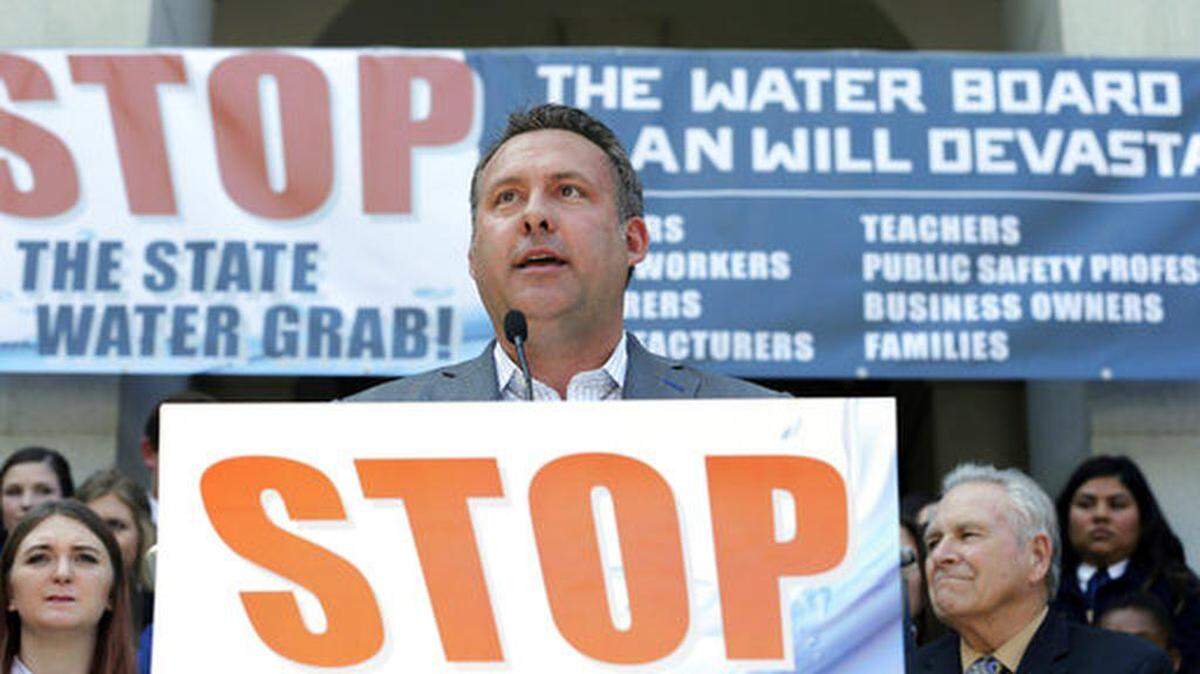 Assemblyman Adam Gray, D-Merced, speaks at an August rally at the Capitol against a proposal by state water officials to increase water flows for the lower San Joaquin River to protect fish. Gov. Gavin Newsom is offering a compromise plan.