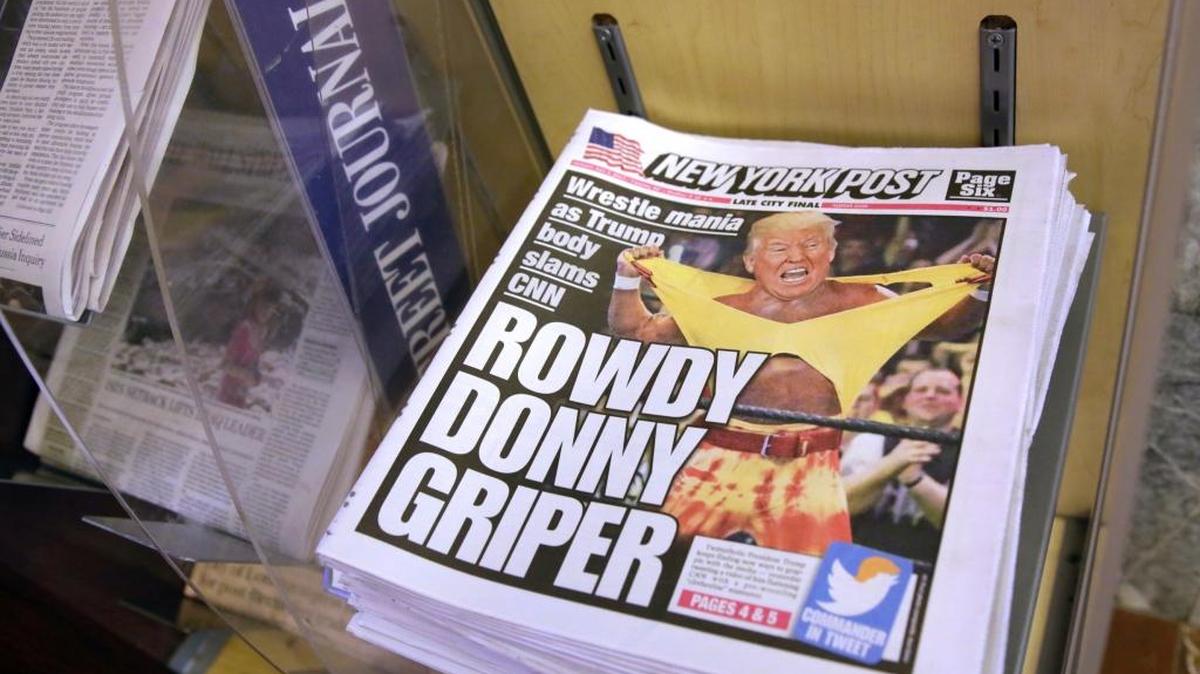 Copies of the New York Post with an illustration of President Donald Trump as a professional wrestler on the front page are displayed at a newsstand in New York City. Trump’s fondness for wrestling emerged in a tweeted video that shows him pummeling a man in a business suit with the CNN logo for a head.