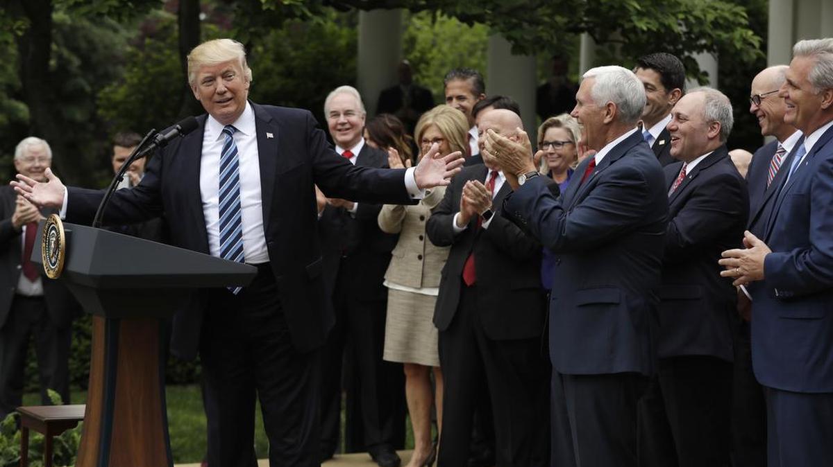 President Donald Trump speaks in the Rose Garden of the White House in Washington, Thursday after the House pushed through a health care bill. House Majority Leader Kevin McCarthy, R-Bakersfield, is at far right.