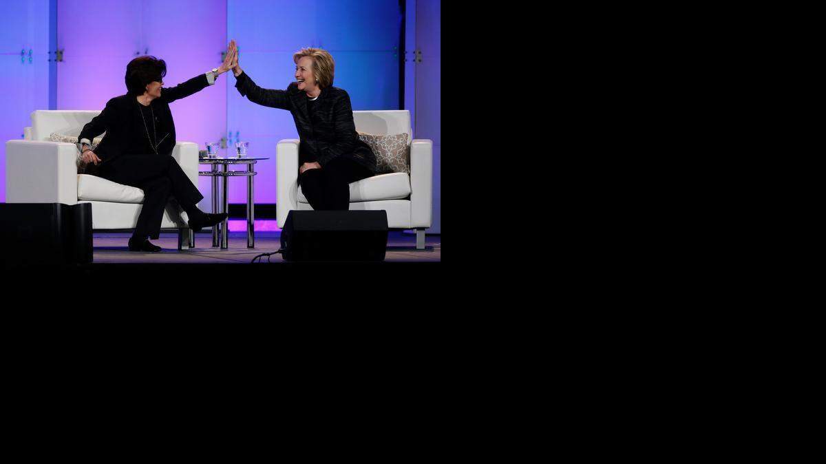 Hillary Rodham Clinton, right, and technology commentator Kara Swisher high-five during a keynote address at the Watermark Silicon Valley Conference for Women on Tuesday<137>, Feb. 24, 2015,<137> in Santa Clara, where Clinton spoke of the income disparity for women<137>, pointing out that Forbes’ list of the top 100 venture capitalists last year had exactly four females<137>. <137>Calif. (AP Photo/Marcio Jose Sanchez)<137>