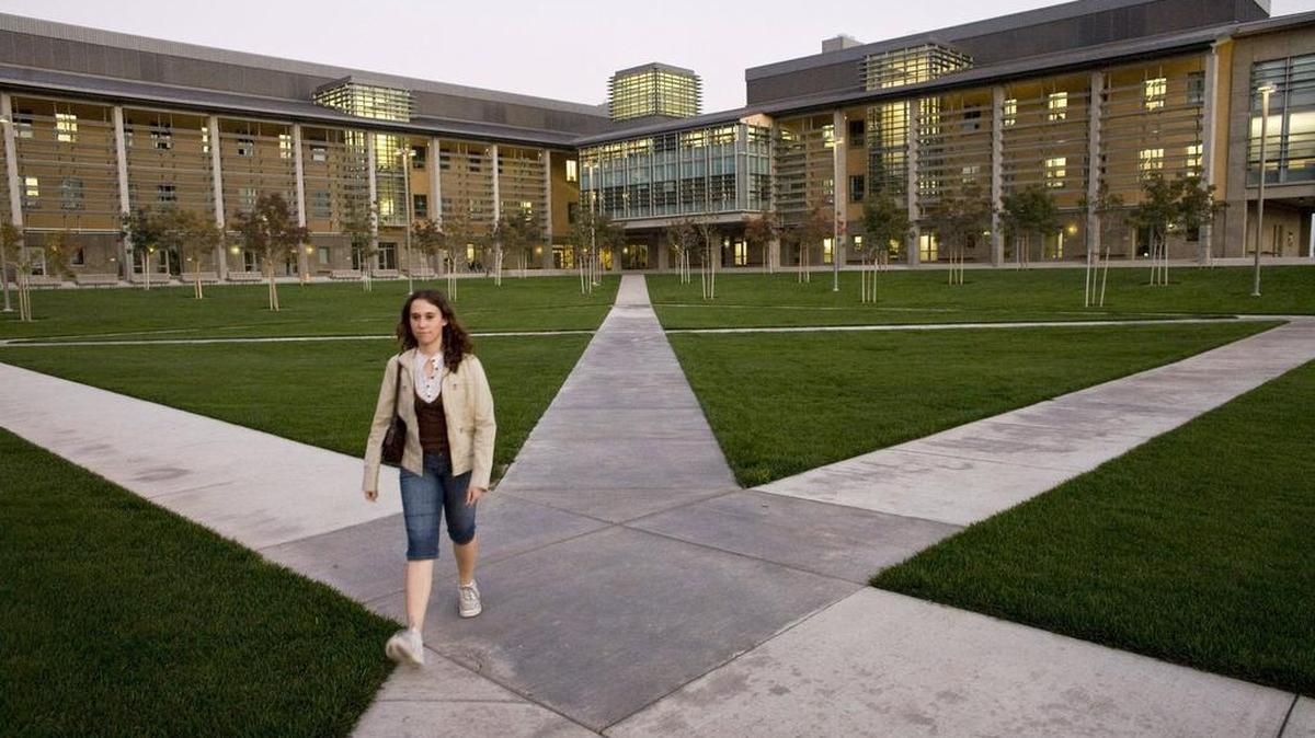 A student at UC Merced walks through the campus, which, it is hoped, will someday include a medical school – which has been talked about since the campus became a reality in 2006.