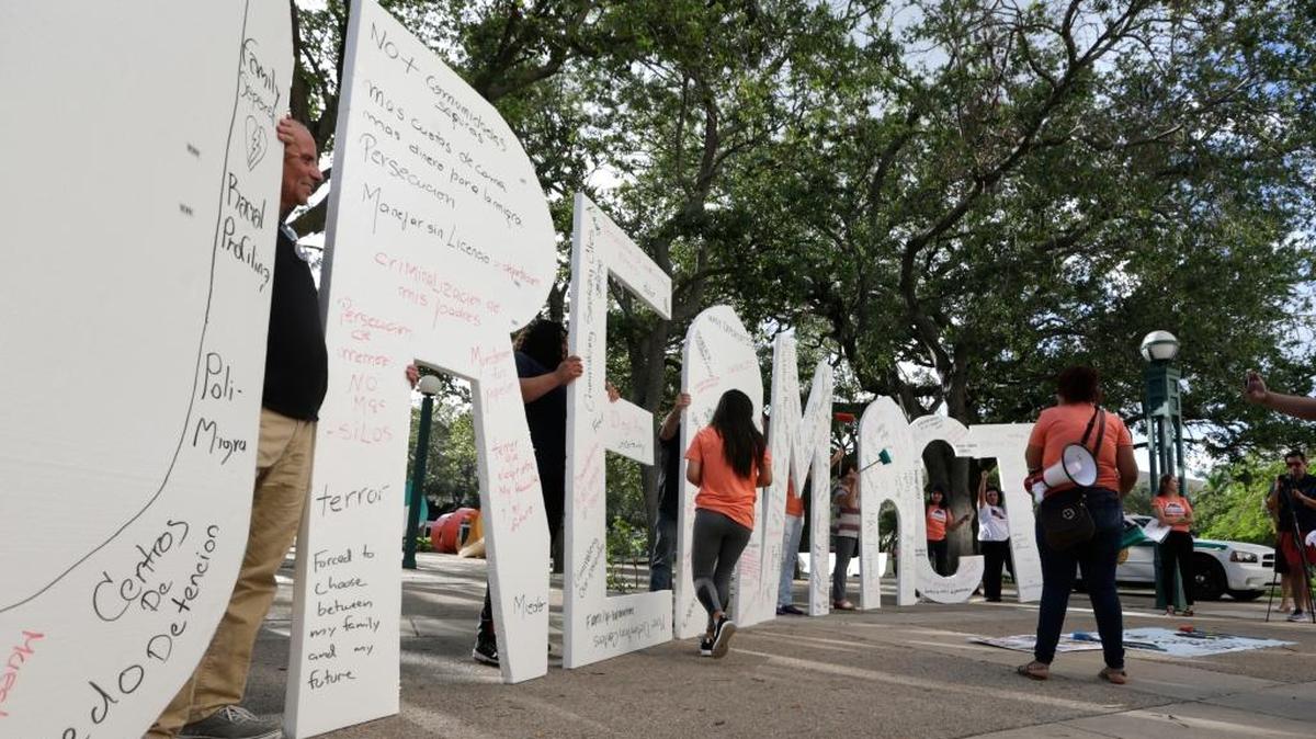 Immigrant rights supporters hold giant letters reading “Dream Act” as they demonstrate in favor of Congress passing a “clean” Dream Act that will prevent the deportation of young immigrants known as Dreamers working and studying in the U.S.