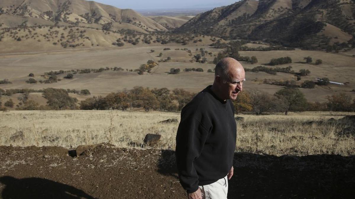 Jerry Brown walks along his 2,514-acre family ranch in Colusa County. Already a sharp critic of the Trump administration’s climate policies, could he lead Oregon, Washington and California in building a metaphorical “blue wall”?
