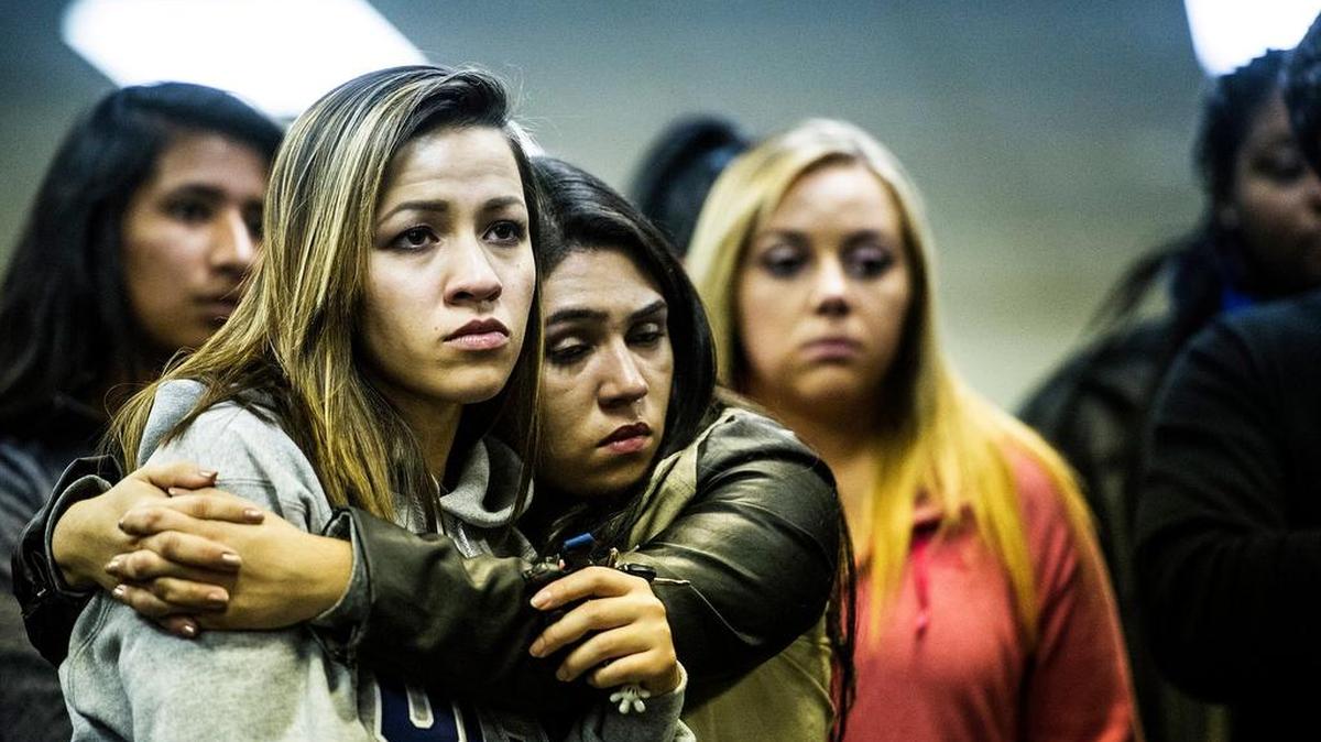 UC Merced junior Vanessa Dias, 20, of Tracy, left, is hugged by fellow student Maria Higareda-Marquez, 20, of Merced, right, during a gathering at Vault Works in downtown Merced, Calif., Wednesday, Nov. 4, 2015. Students held the gathering in a show of support for one another after a man stabbed four people on the UC Merced campus before being shot and killed by UC Merced police Wednesday morning.