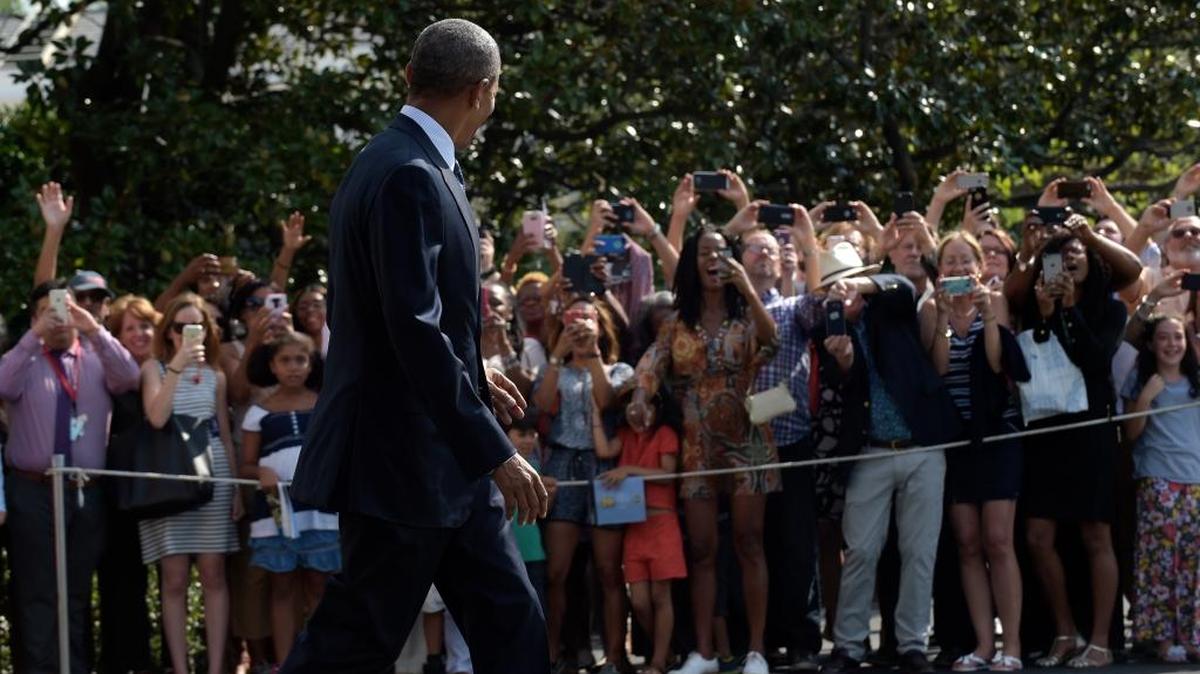President Barack Obama walks towards Marine One on the South Lawn of the White House in Washington, Wednesday as he prepares to depart on his last trip to Asia; his trip will include stops in China and Laos.