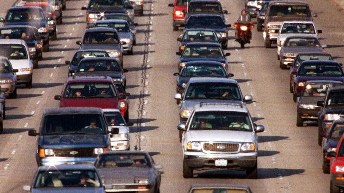 Morning commuter traffic crawls in the westbound lanes of Interstate 10 near downtown Los Angeles, in this 1999 file photo. California motorists drive 330 billion miles a year, creating the nation’s worst traffic congestion and pounding roadways so badly that it has one of the nation’s worst pavement condition levels.