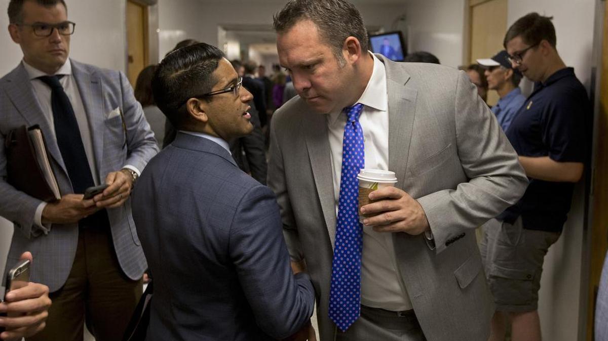 Assemblyman Adam Gray, D-Merced, right, talks with Rodney Wilson, legislative advocate for the California Credit Union League, in the hallway of the Capitol on Aug. 25, as the 2014-16 biennial session neared its close.