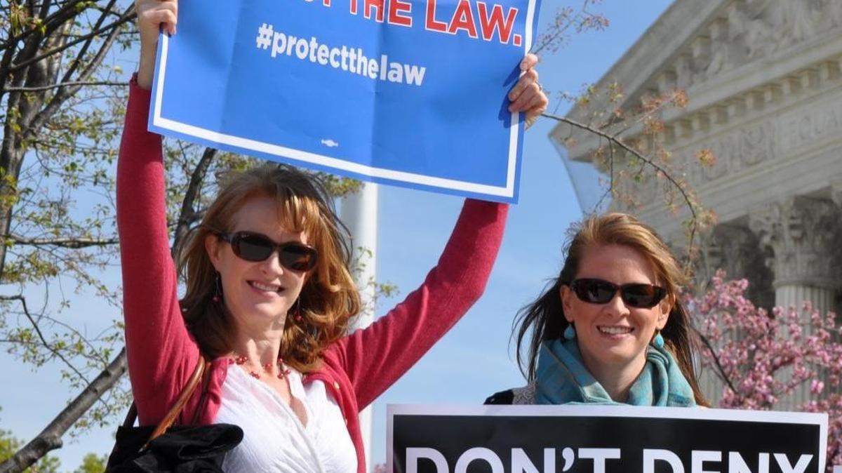 Alison Buist, left, expresses an opinion about the proposed American Health Care Act authored by Rep. Paul Ryan and championed by President Trump.