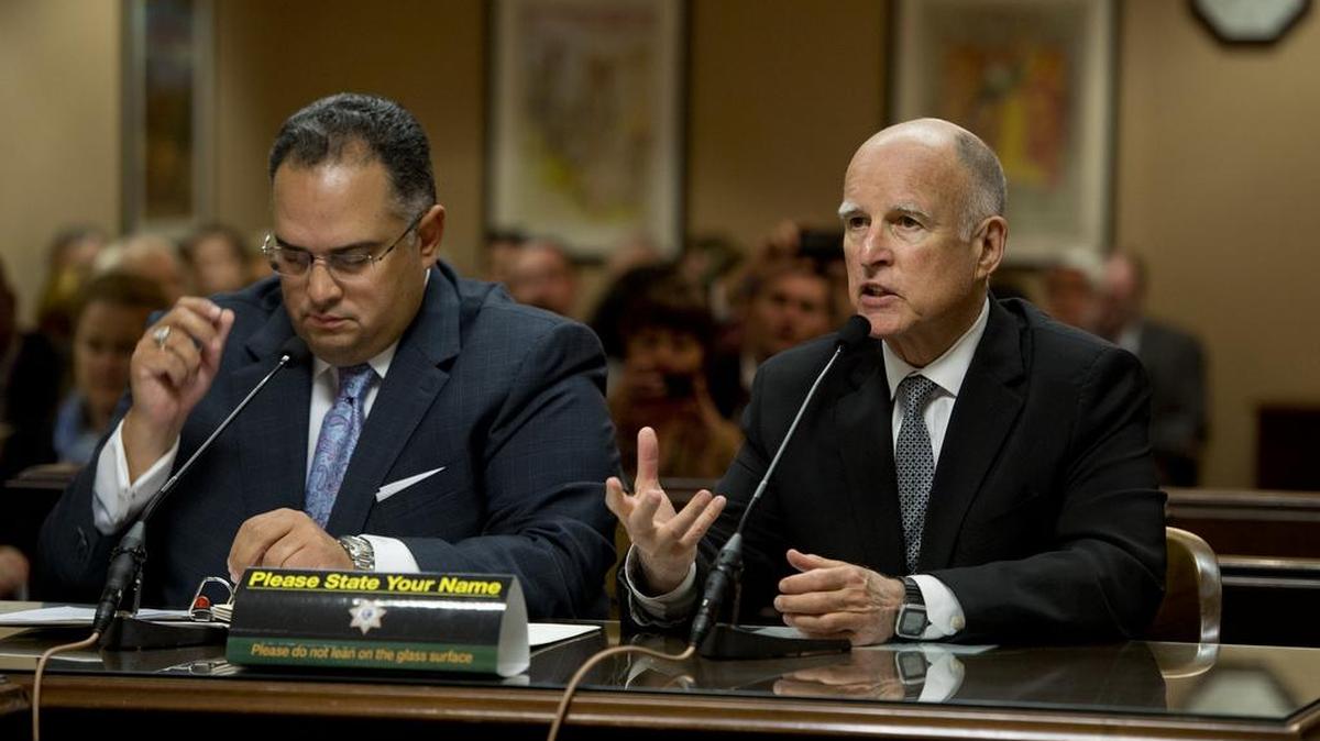 Gov. Jerry Brown and John Pérez, then the speaker of the state Assembly, jointly appeared before an Assembly committee in 2014 to promote Brown’s plan to create a rainy day fund, which appeared on that year’s ballot as Proposition 2.