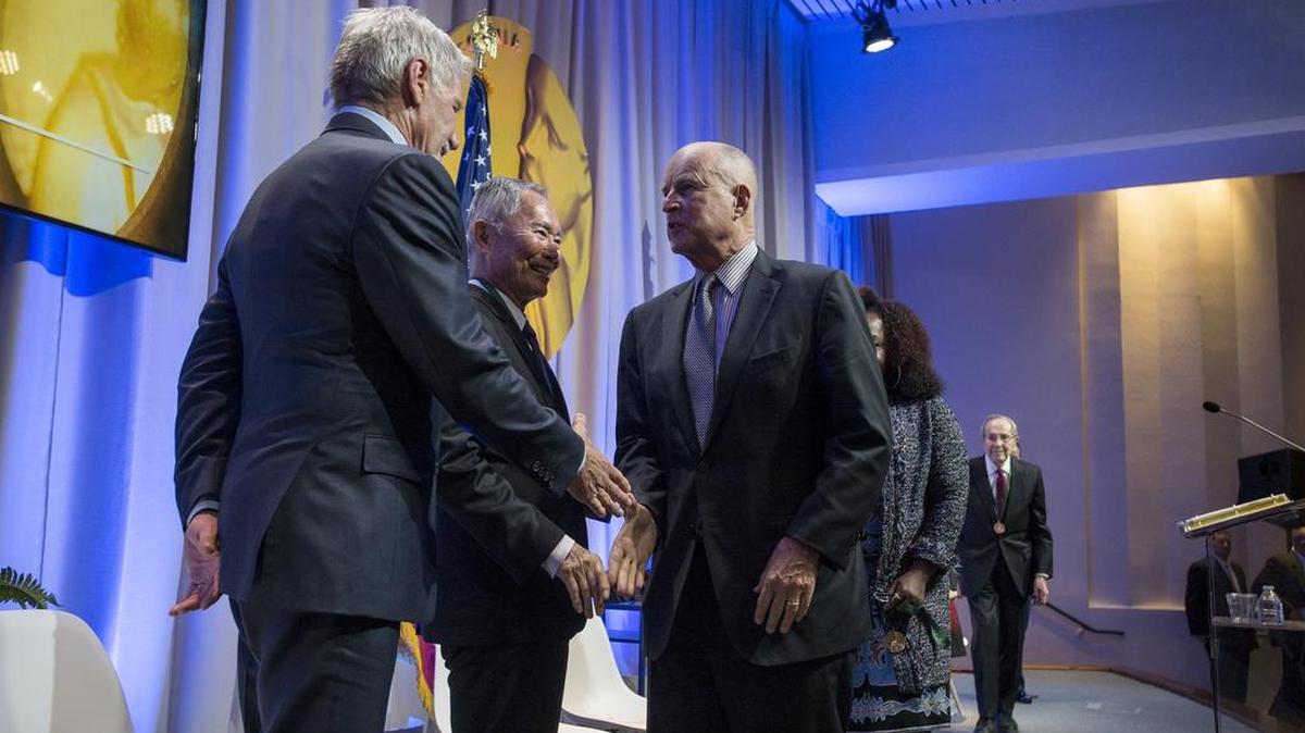 Inductees George Takei and Harrison Ford shakes hands with Gov. Jerry Brown following the California Hall of Fame ceremony at the California Museum on Nov. 30, 2016.