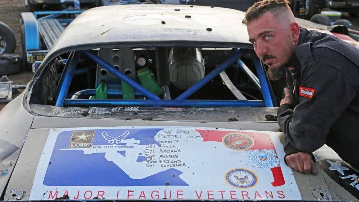 (041517 Merced, CA) SPC Jerry Tubbs of Winton has a hand-painted list on the trunk lid of his Camaro Hobby Stock, listing those veterans he knew who lost their lives. He races the car in the Hobby Stock division at Merced Speedway on Saturday night. Saturday, April 15, 2017. Staff photo by Mike Adaskaveg.