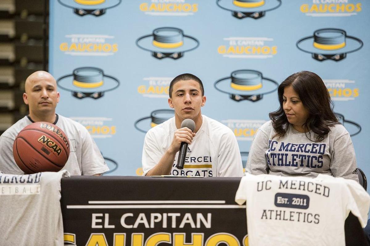 El Capitan senior Angel Serena thanks his parents and coaches during a ceremony at El Capitan High School in Merced, Calif., on Friday, April 27, 2018. Serena signed his letter of intent to attend and play basketball for the University of California, Merced.