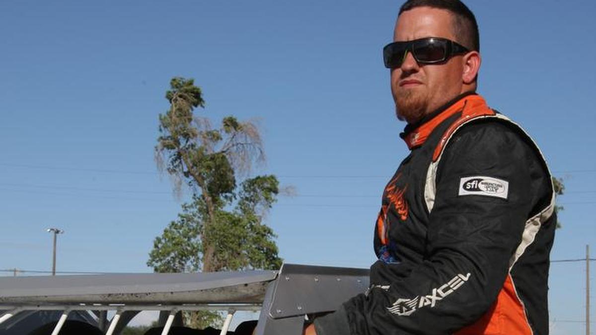 Jeremy Hoff prepares to enter his car as waits for the SportMod division heat race to be called to staging at Merced Speedway.   (Mike Adaskaveg Photo)