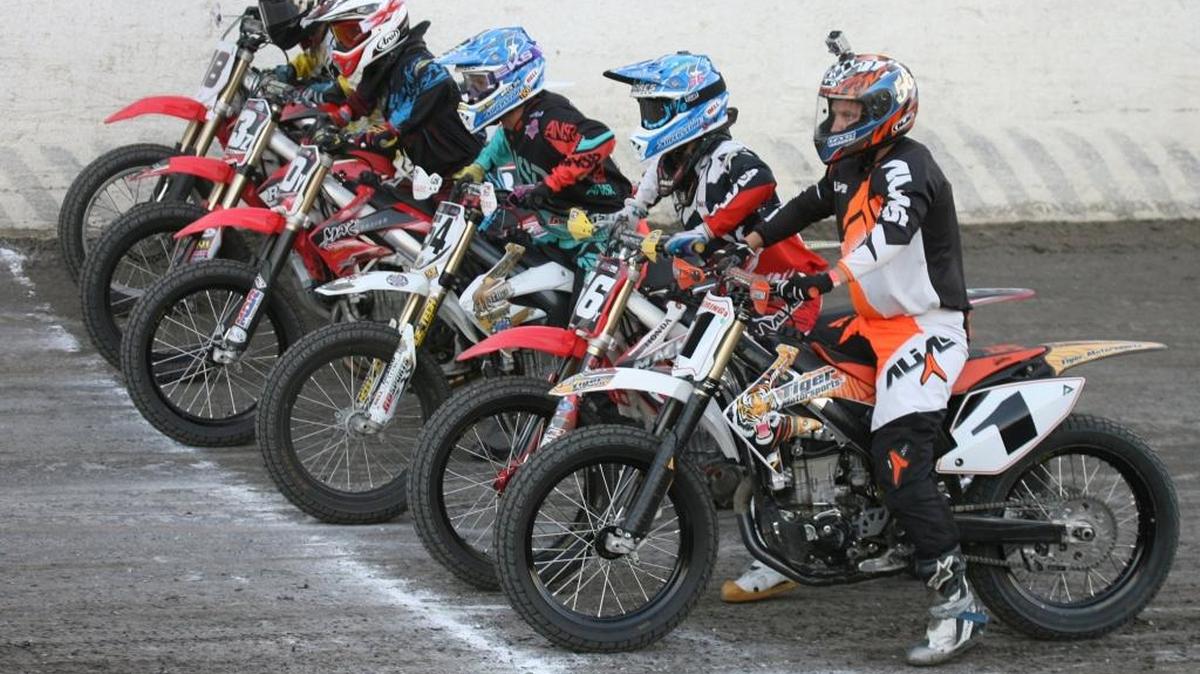Merced Speedway - Flat Track Motorcycle Racers line up for a heat race last year. Many divisions of riders will compete in amateur and professional races at Merced Speedway Saturday, as the California Flat Track Racing Association holds its Western Championships presented by Barhoppers Motorcycle Club of Merced. (MikeAdaskavegPhoto)