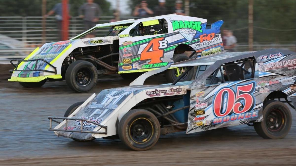Bruce “Bubba” Nelson of Winton (48) passes Jarrod Mounce of Merced coming out of the second turn at Merced Speedway during IMCA SportMod comeptition.Photo by Mike Adaskaveg