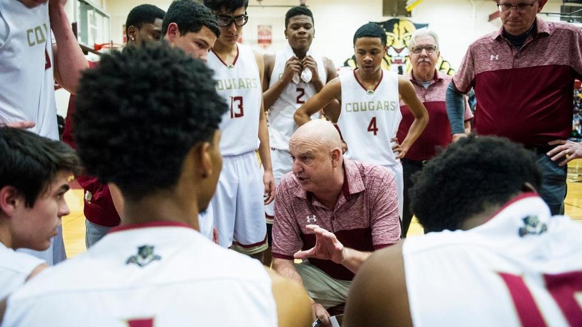 Golden Valley head coach Keith Hunter speaks to his players during a game against Merced at Golden Valley High School in Merced, Calif., on Friday, Jan. 19, 2018. Golden Valley High is honoring Hunter for reaching 400 career wins with a short ceremony on Friday prior to the start of the varsity game against Turlock at Cougar Arena.