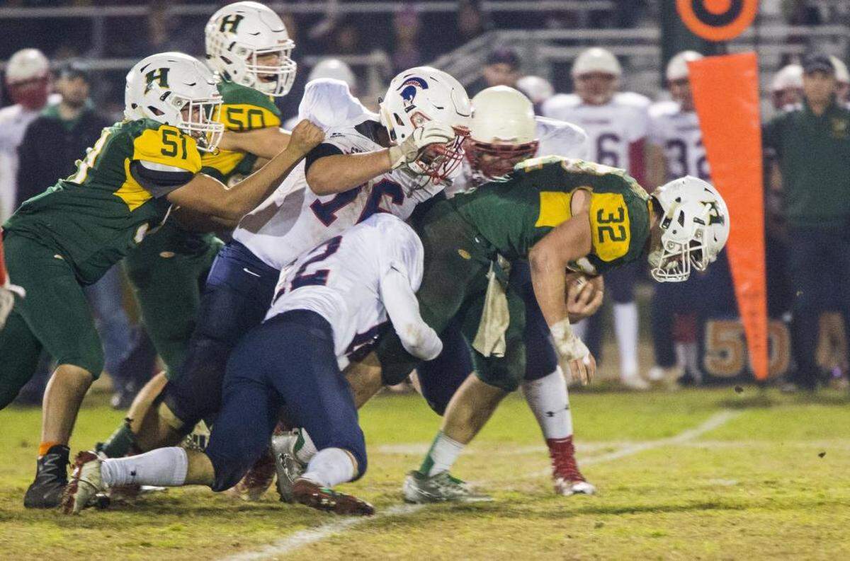 Justin Rentfro (32) of Hilmar High works his way through the defensive line of Strathmore. Hilmar takes on Strathmore during the CIF State Northern California Division VI-AA Dec. 1st 2017 at Hilmar High.