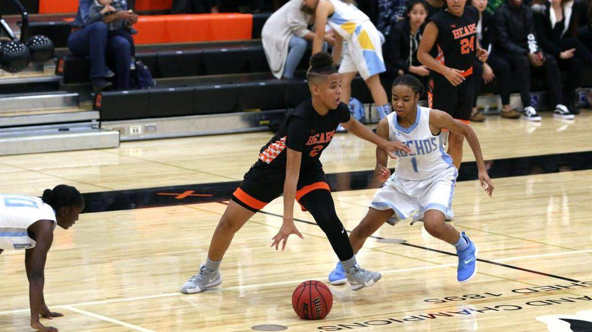 El Capitan’s Amaya Ervin (1) defends Merced’s Amari Stamps during the Gauchos’ 60-45 win over the Bears on Tuesday night at Merced High.