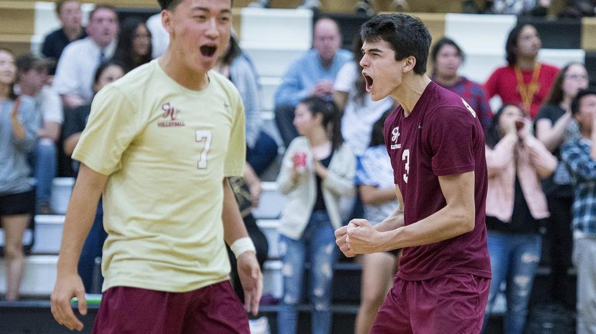 Golden Valley junior Bryan Livesay (3), right, and junior Lor Xiong (7) are seen celebrating a Cougars point during a match against Buhach Colony at Buhach Colony High School in Atwater, Calif., on Thursday, April 26, 2018. The Cougars beat the Thunder 3-0.