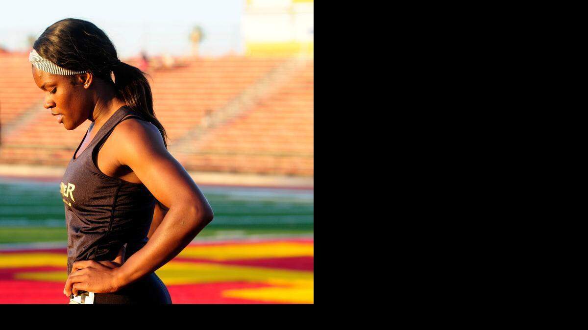
Buhach Colony's Brandy Coward cools down after a win in the 100 meter dash, during the "County Clash" track meet between Merced and Stanislaus county high schools, on Friday (3-27-15) at Oakdale High. 

