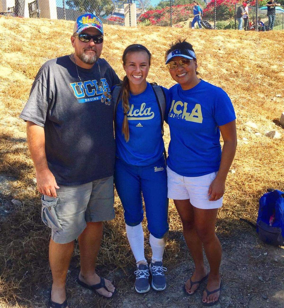 Ted Nickles and his wife Natalie pose with daughter Madilyn Nickles after her first fall ball game against San Marcos during her freshman year at UCLA. The Nickles have been to all 187 of Madilyn’s softball games since she arrived at UCLA, including the College World Series games this weekend in Oklahoma City.