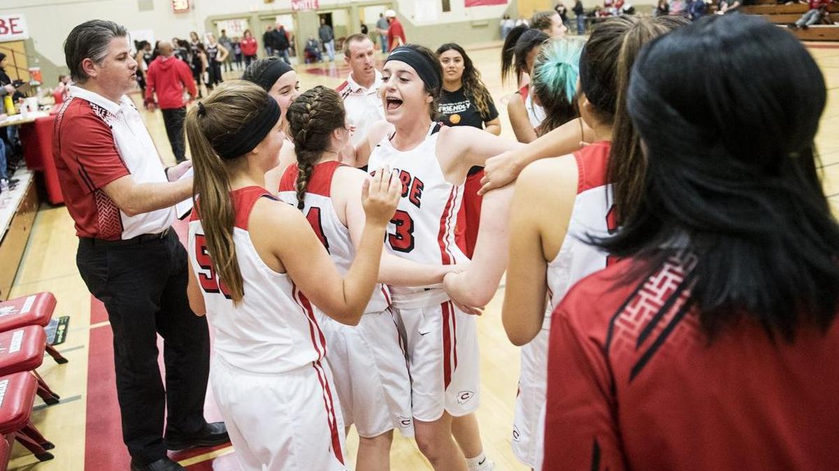 Chowchilla players celebrate a 54-39 win over the Granite Hills Grizzlies following a CIF Central Section Division V playoff game at Chowchilla High School in Chowchilla, Calif, on Friday, Feb. 23, 2018.