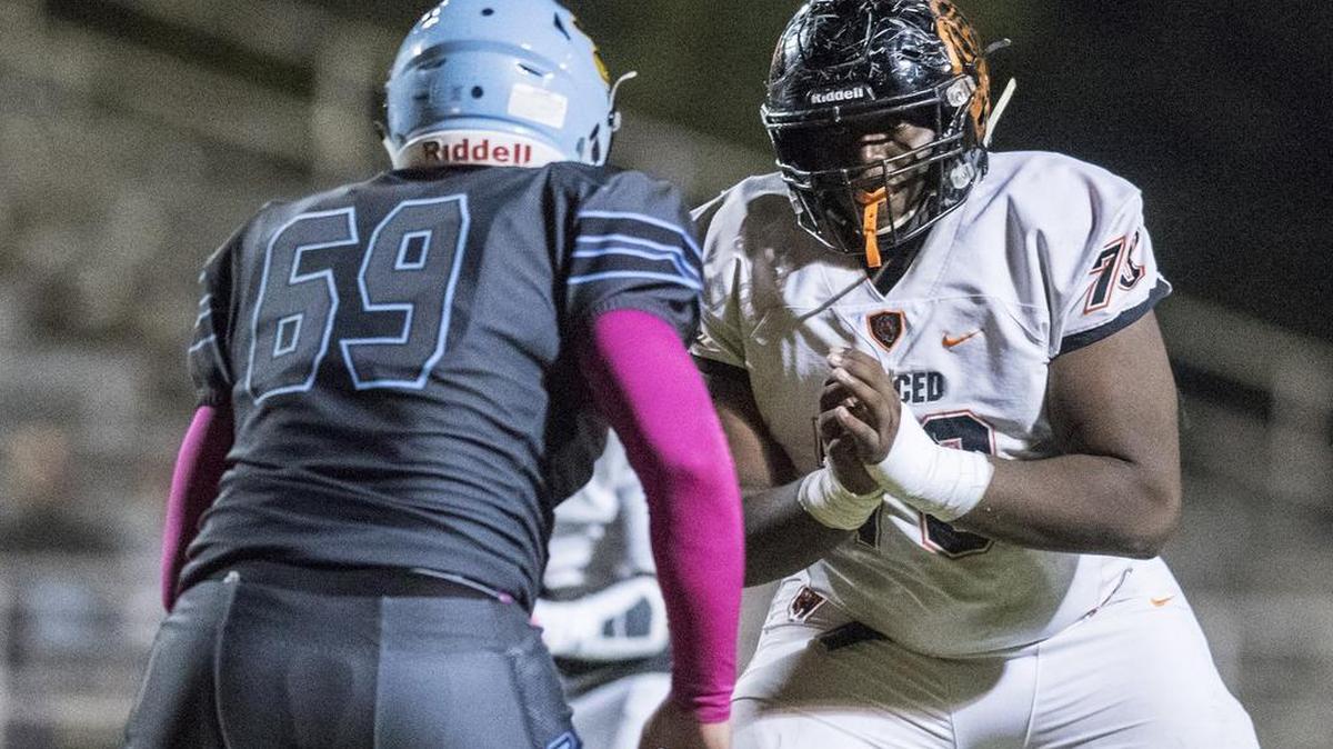 Merced’s Clifford Johnson (79) engages El Capitan’s Jake Leonardo (69) during a game at Stadium ’76 last season.