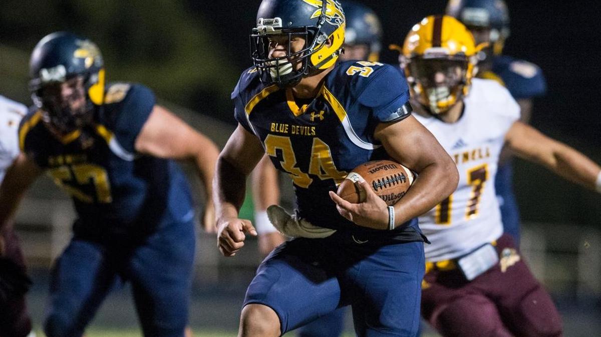 Merced College freshman Hanisi Lotulelei (34) rushes during a game against Hartnell at Stadium '76 earlier this season. Lotulelei was named the Golden Coast Conference Offensive Player of the Year after rushing for 1,300 yards this season.