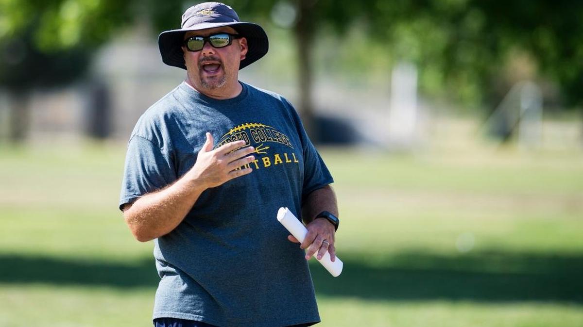Merced College head coach Bob Casey speaks to his players during practice at Merced College in Merced, Calif., on Thursday, Aug. 31, 2017.