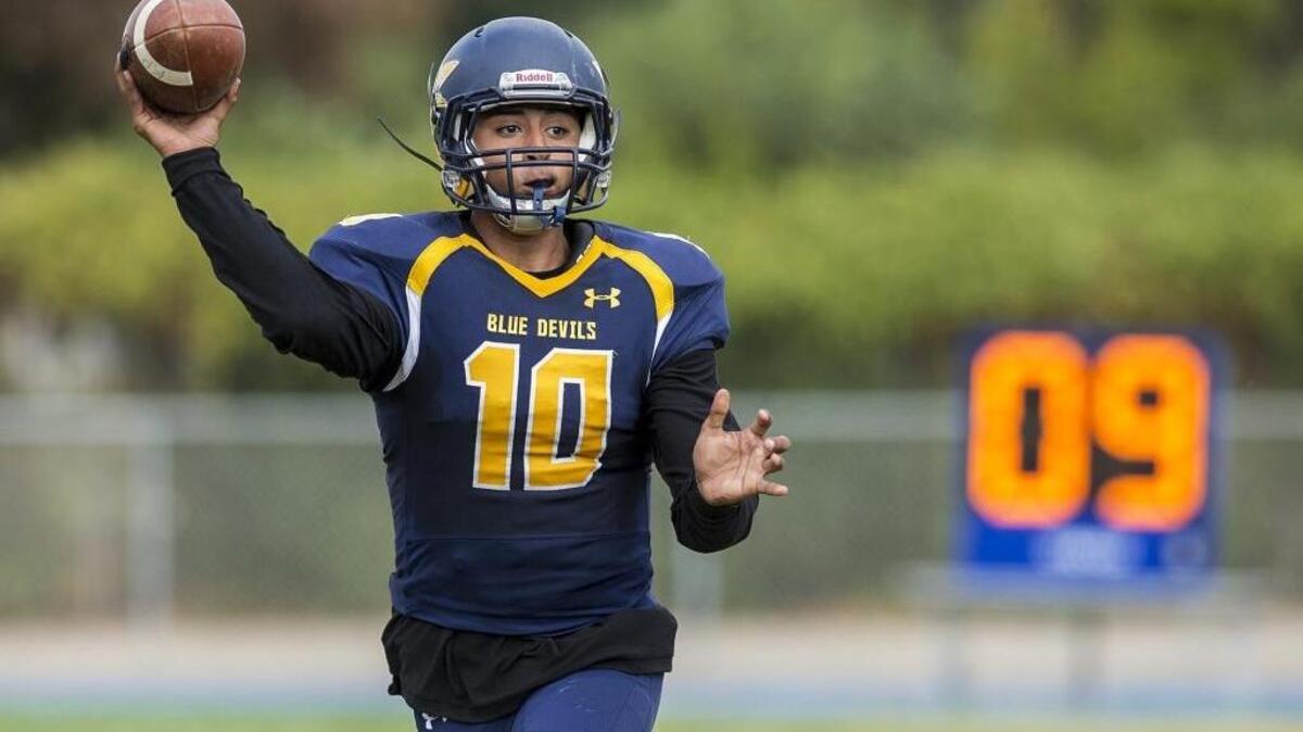 Merced College sophomore quarterback Frank Cocio (10) throws a pass during a game against Yuba College at Stadium '76 in Merced, Calif., on Saturday, Nov. 4, 2017. The Blue Devils beat the 49ers 37-7.