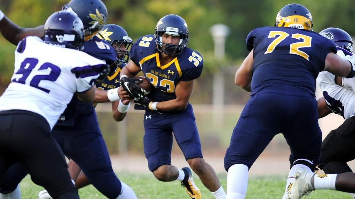 Merced running back Alex Gutierrez (33) sees an opening but eventually has to run to the outside, during a Saturday night community college football matchup between San Jose City College and Merced College at Stadium 76 in Merced, Calif. on September 9, 2017.